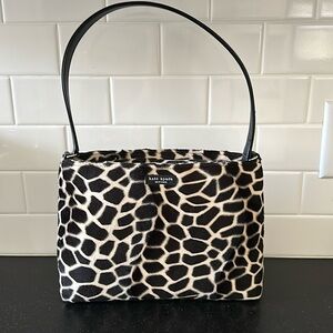 Kate Spade, Giraffe Faux Fur Animal Print Leather Handbag. Stain inside purse.